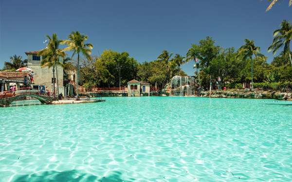 Aerial view of Venetian Pool in Coral Gables Miami showing Mediterranean architecture and crystal clear water
