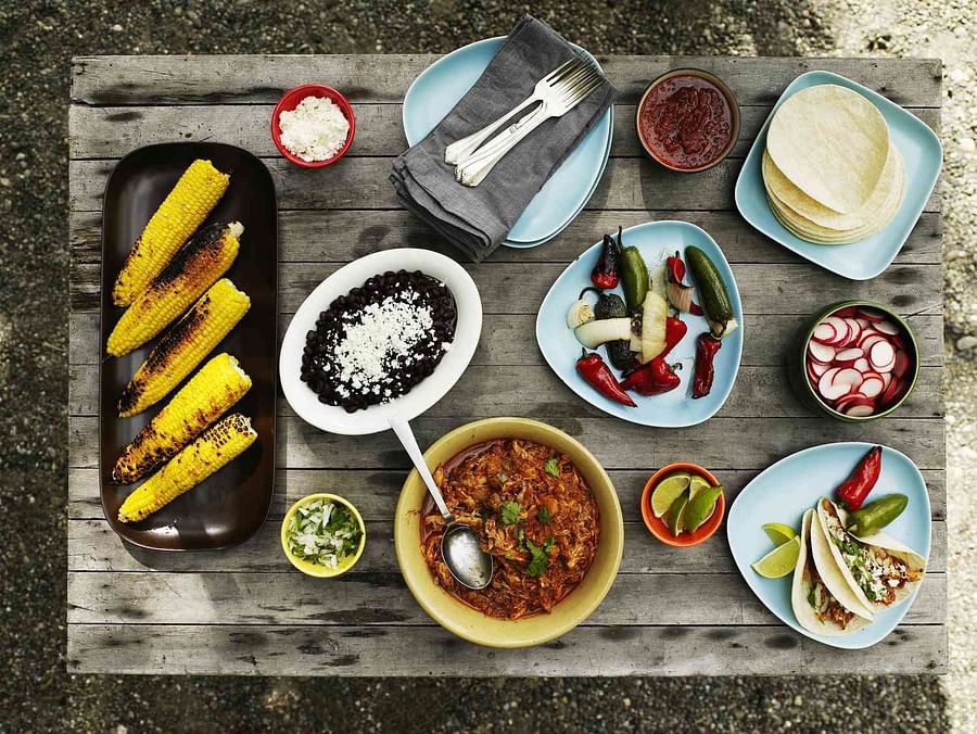 Traditional Mexican food spread on a rustic table