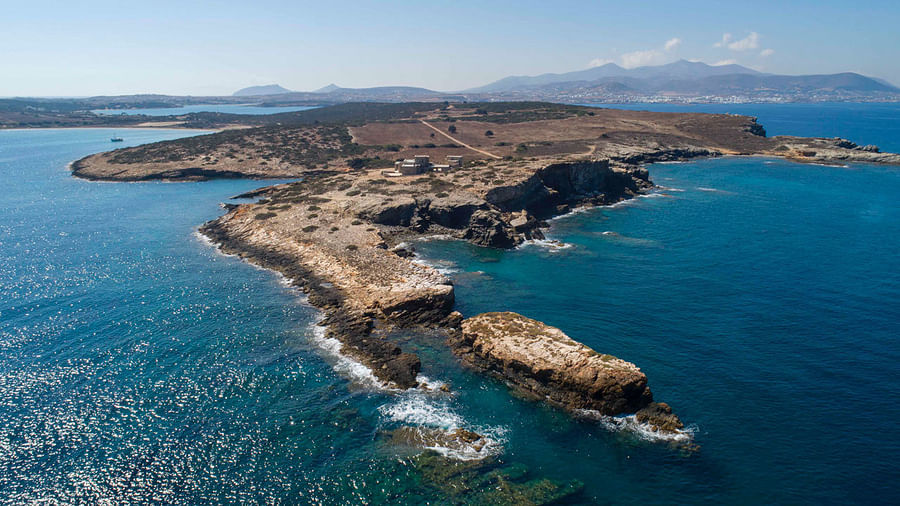 Breathtaking panoramic view of a secluded Greek island surrounded by azure waters