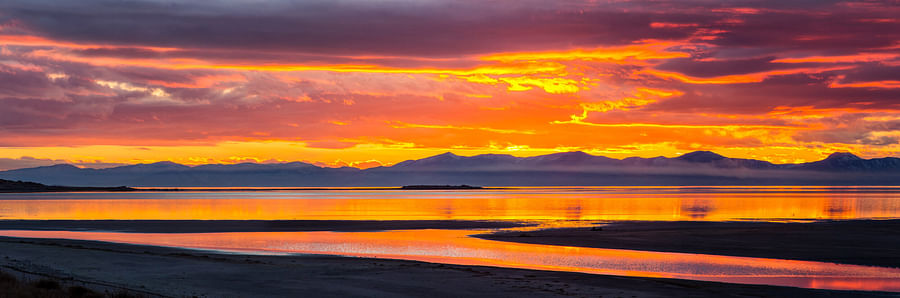 Panoramic view of Utah\'s diverse landscapes featuring mountains, desert, and forests